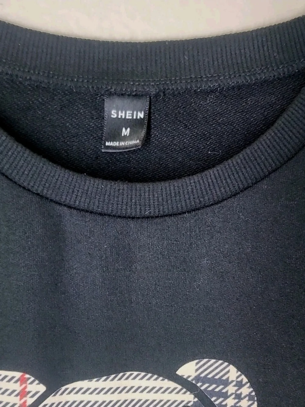 SHEIN Black Crewneck Sweater with White Teddy Graphic